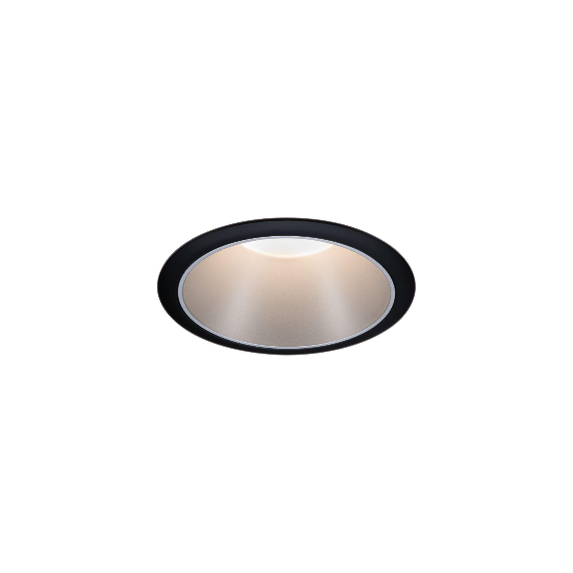 Round black LED recessed light with warm white glow for modern indoor lighting solutions