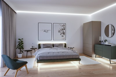 Modern bedroom with LED strip lighting, green bed with grey bedding, wooden floor and minimalist decor