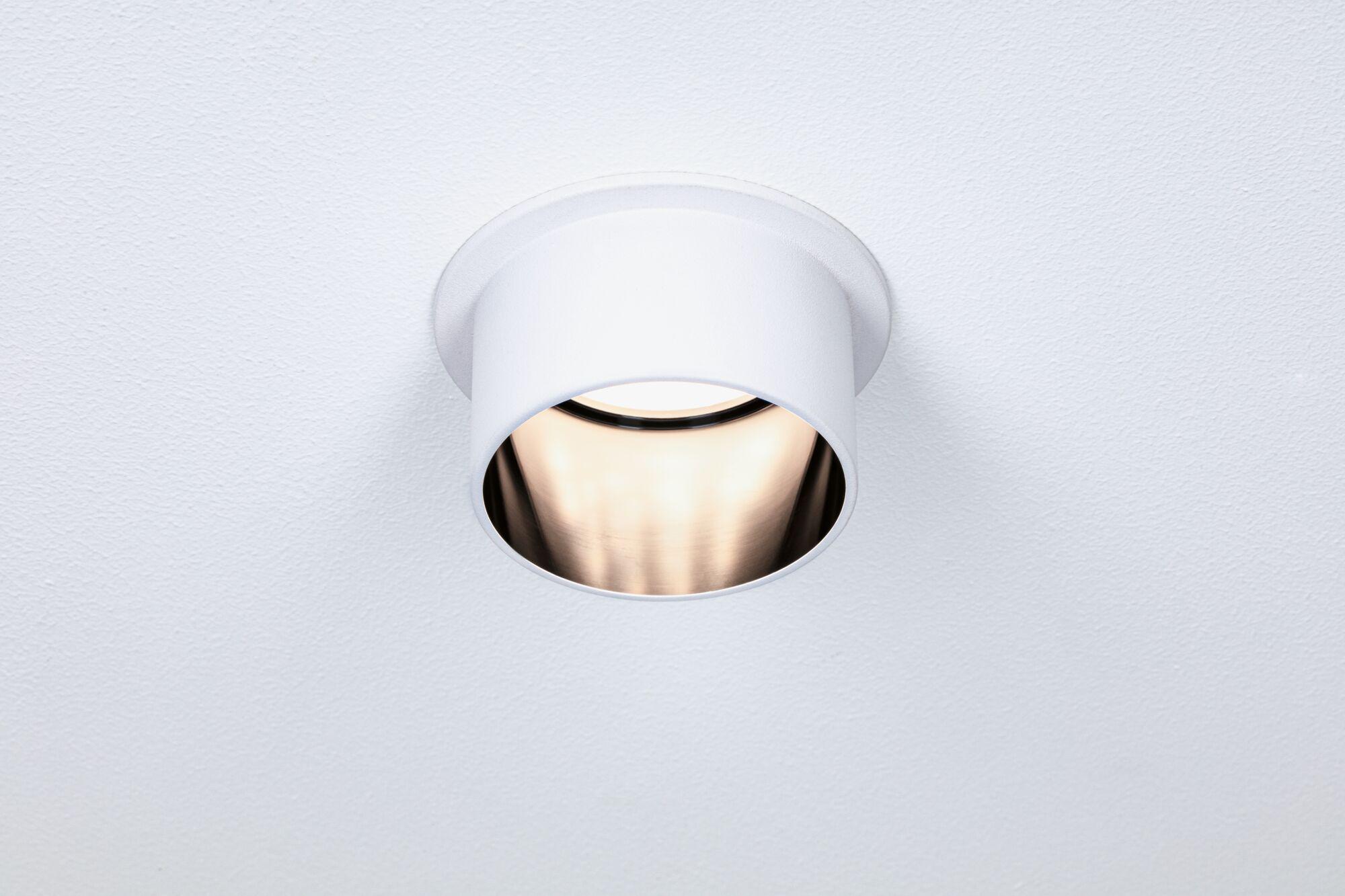 White metal recessed spotlight with warm LED light for modern indoor lighting solutions