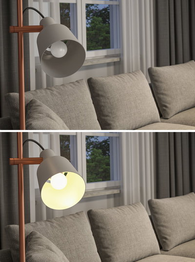 Moderne vloerlamp met grijze metalen kap en koperen frame naast een grijze bank in woonkamer.