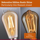 Comparison of two decorative light bulbs with thin filament strands in warm glow Rustic Shine edition