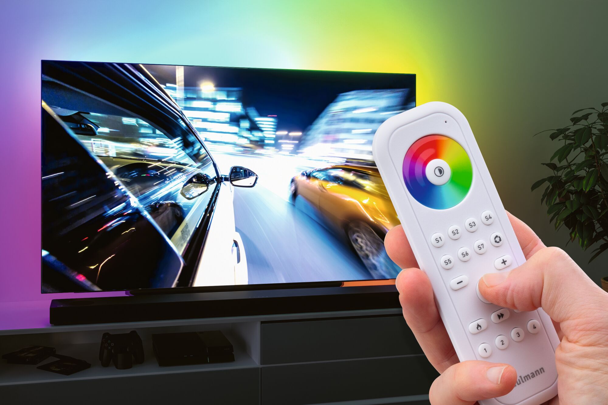 Télécommande blanche avec roue de couleur contrôlant le rétroéclairage LED du téléviseur pour ambiance