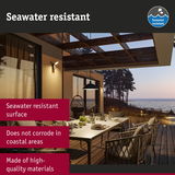Outdoor dining area with seawater resistant lighting and high-quality materials for coastal durability