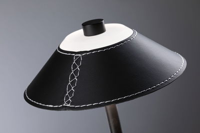 Black leather lampshade with white stitching and black knob for modern lighting design