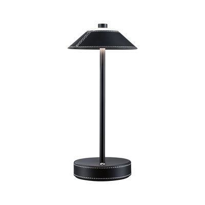 Modern black table lamp with leather cover and white stitching, minimalist design for living spaces