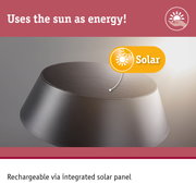 Grey round rechargeable battery with integrated solar panel for sustainable solar energy use.