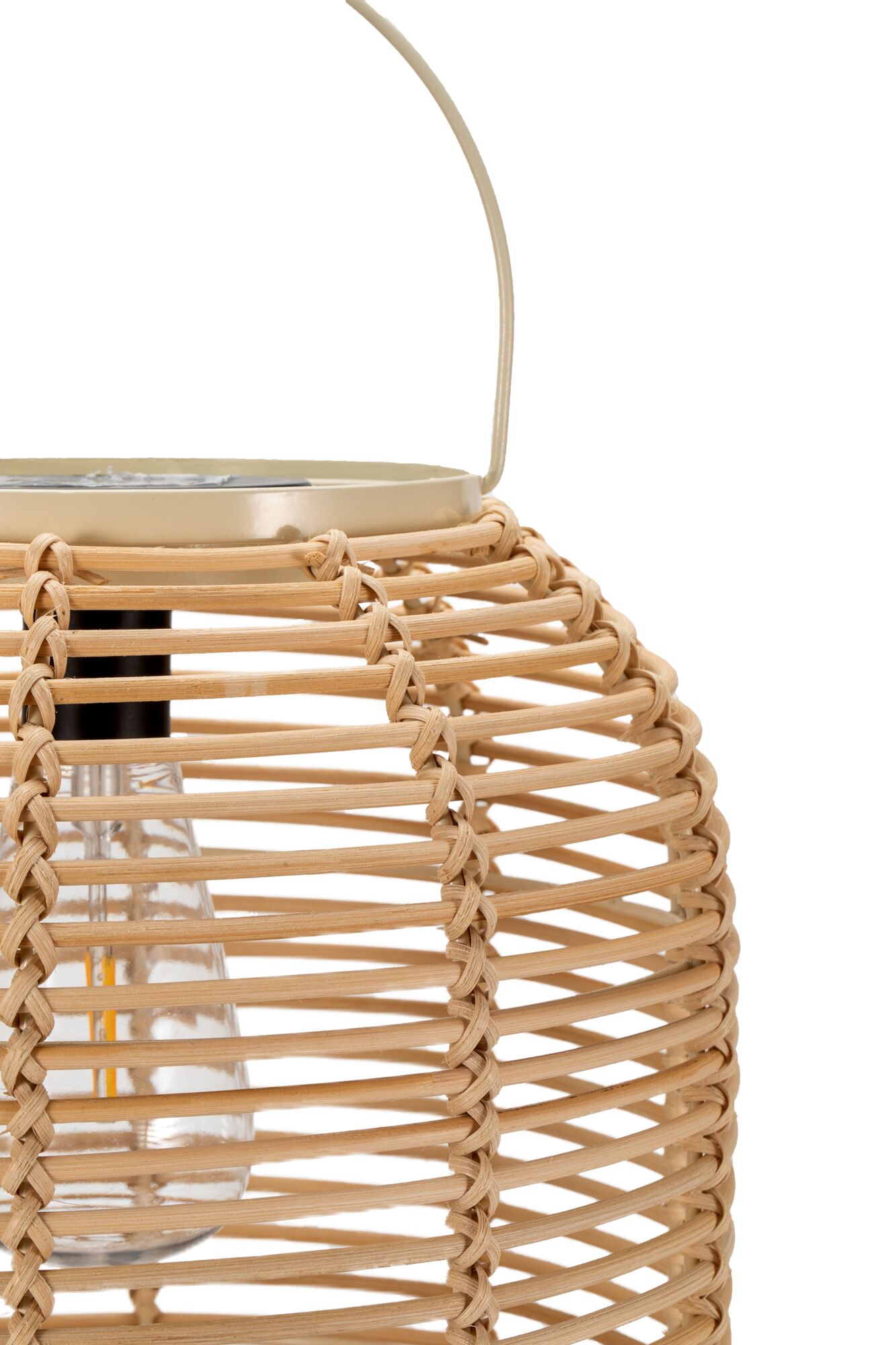 Natural rattan lantern with glass insert and beige metal handle for ambient lighting