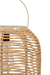Natural rattan lantern with glass insert and beige metal handle for ambient lighting