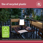 Sustainable balcony lighting with lamp made from over 50% recycled plastic and plants in background