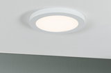Round white LED ceiling light with matte diffuser for modern room lighting and energy-saving illumination.
