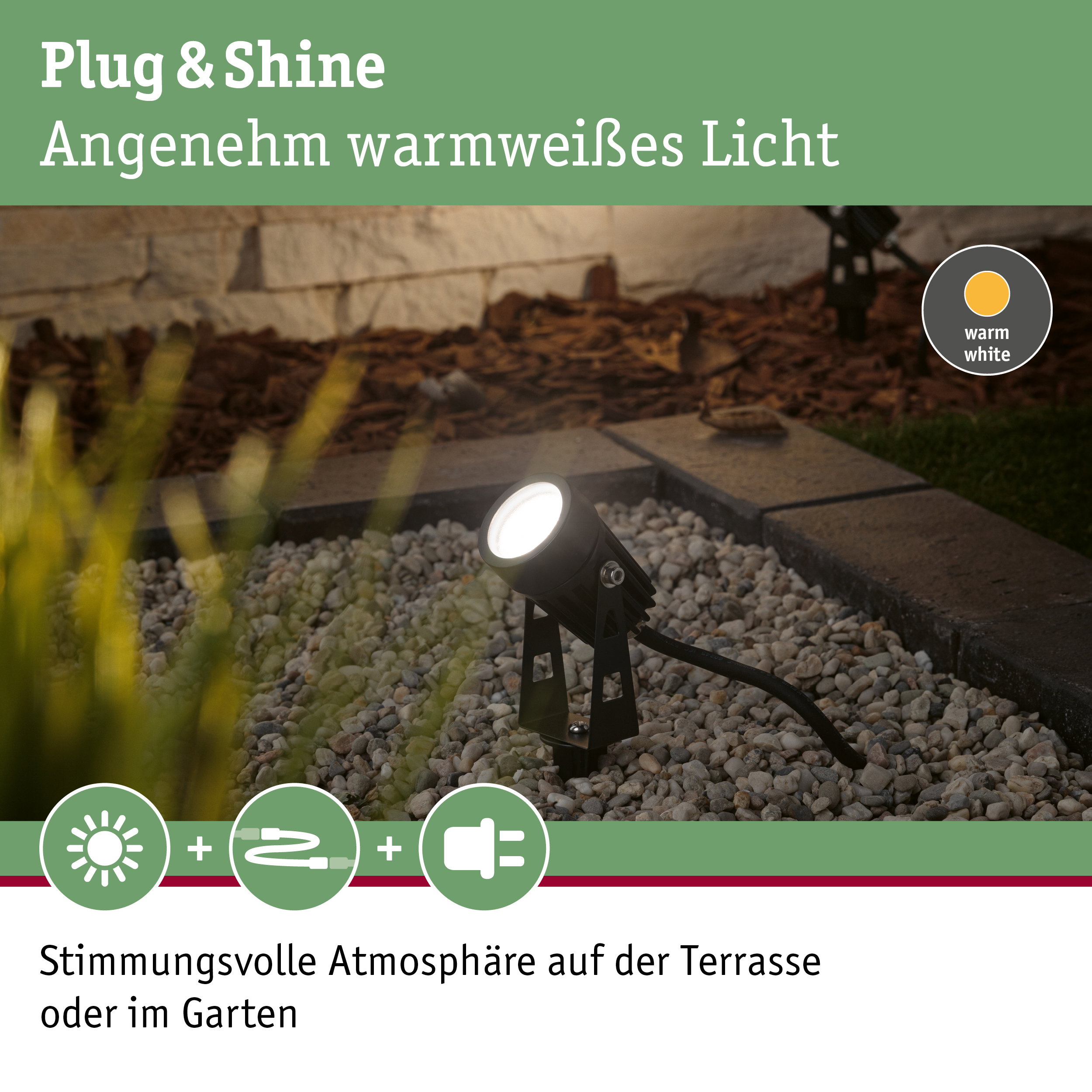 Schwarzer Außenstrahler mit warmweißem Licht auf Kiesfläche für Gartenbeleuchtung und Terrasse