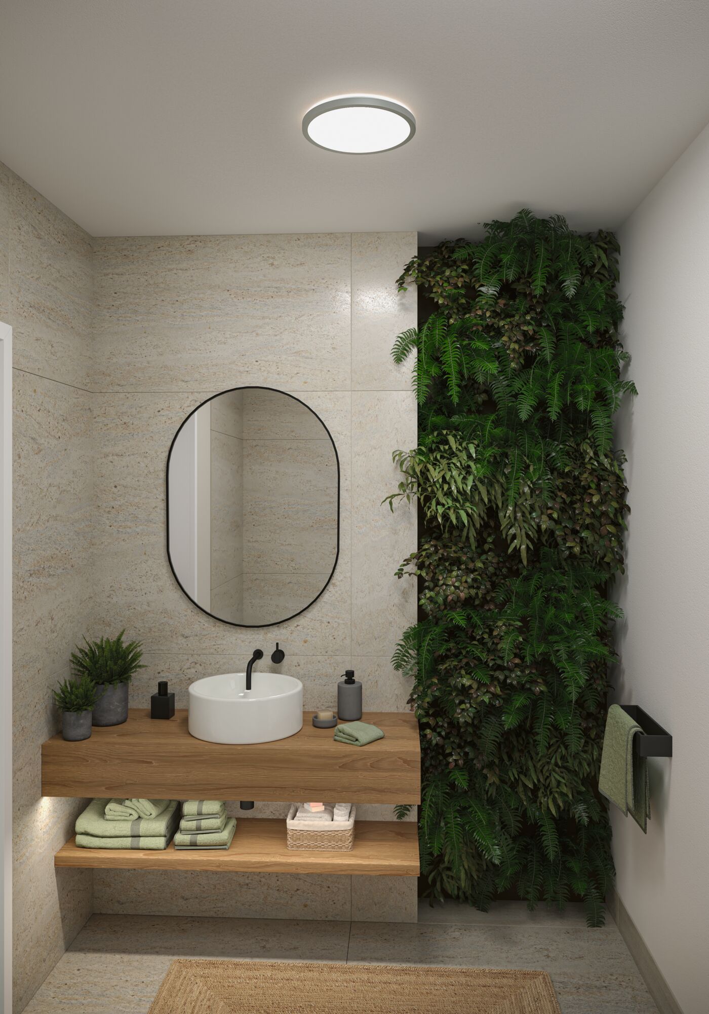 Salle de bain moderne avec plafonnier rond, meuble en bois et mur végétal vert.