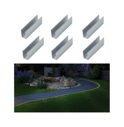Six silver aluminum profiles for LED lighting with a garden path lit by warm white light at night.