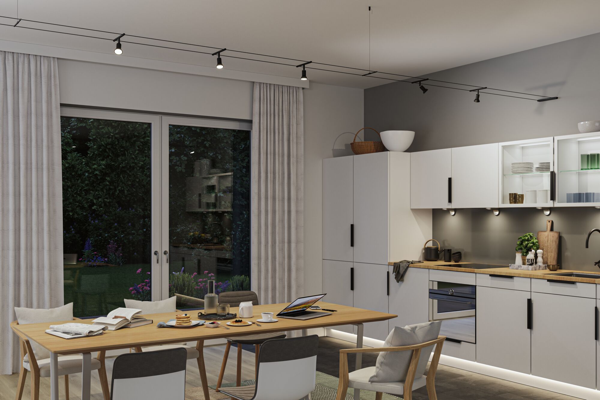 Modern kitchen with white cabinets, wooden countertop and black LED track lighting in living space.