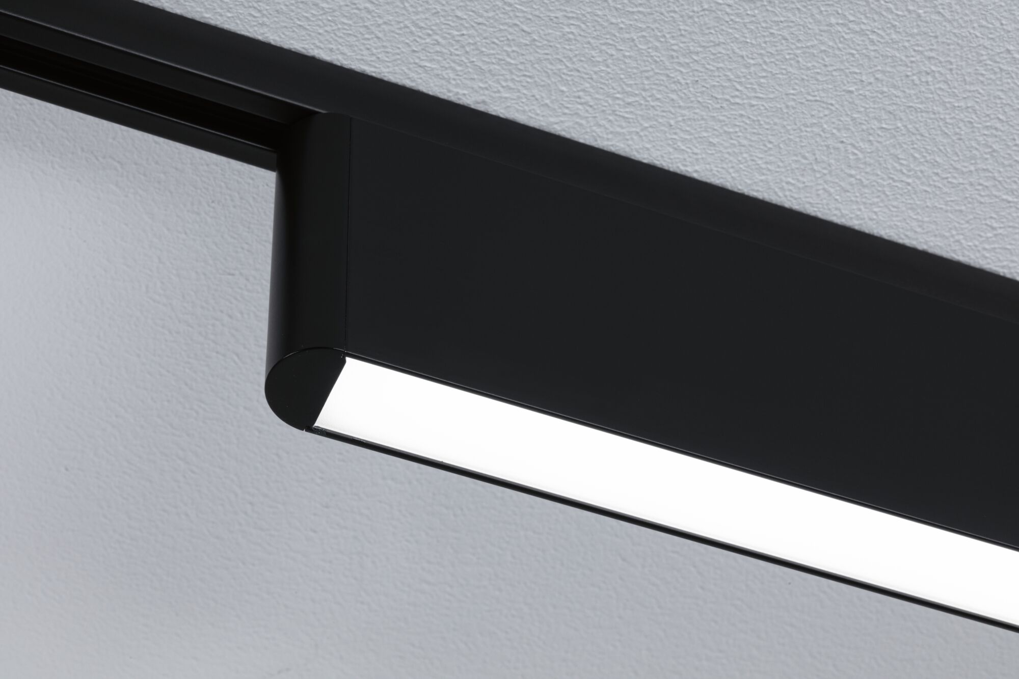 Black metal LED ceiling light with rectangular shape and white diffuser for modern interior lighting
