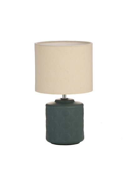 Table lamp with green ceramic base and beige fabric shade for cozy lighting