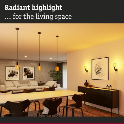 Modern living room lighting with yellow glass pendant lamps and wall lights emitting warm light