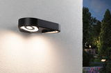 Applique murale extérieure LED noire en métal avec design circulaire, éclairage moderne pour jardin.