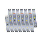 Flexible LED strip with warm white LEDs on silver circuit board for modern lighting effects.