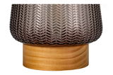 Close-up of brown patterned glass lampshade on light wooden base for home lighting decor