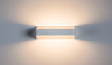 Modern white metal LED wall light with warm white illumination and decorative light effect