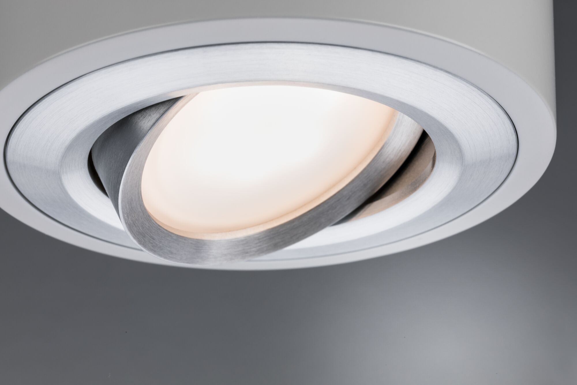 Modern recessed spotlight in brushed silver aluminum with warm white LED light for living spaces