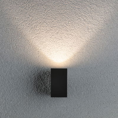 Black rectangular metal wall light with warm white illumination for modern indoor lighting
