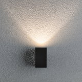 Black rectangular metal wall light with warm white illumination for modern indoor lighting