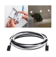 Black and white connection cable for LED recessed lights with bathroom installation.