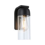 Black metal wall light with clear glass cylinder and visible LED filament bulb for outdoor lighting