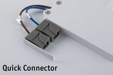 Gray plastic quick connector with brown and blue wires attached to white LED panel for lighting setup.