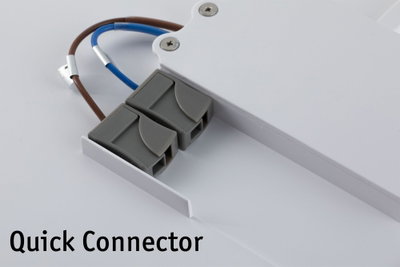 Gray plastic quick connector with brown and blue wires attached to white LED panel for lighting setup.