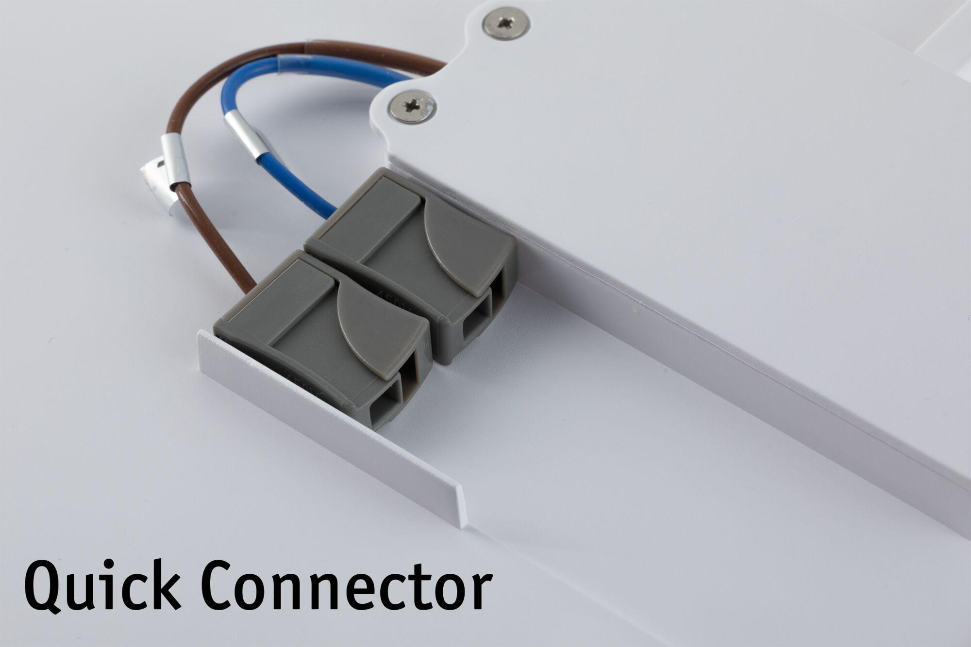 Connecteur rapide gris en plastique avec fils marron et bleu fixé à un panneau LED blanc