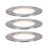 Three round brushed stainless steel LED recessed lights with warm white light for outdoor use