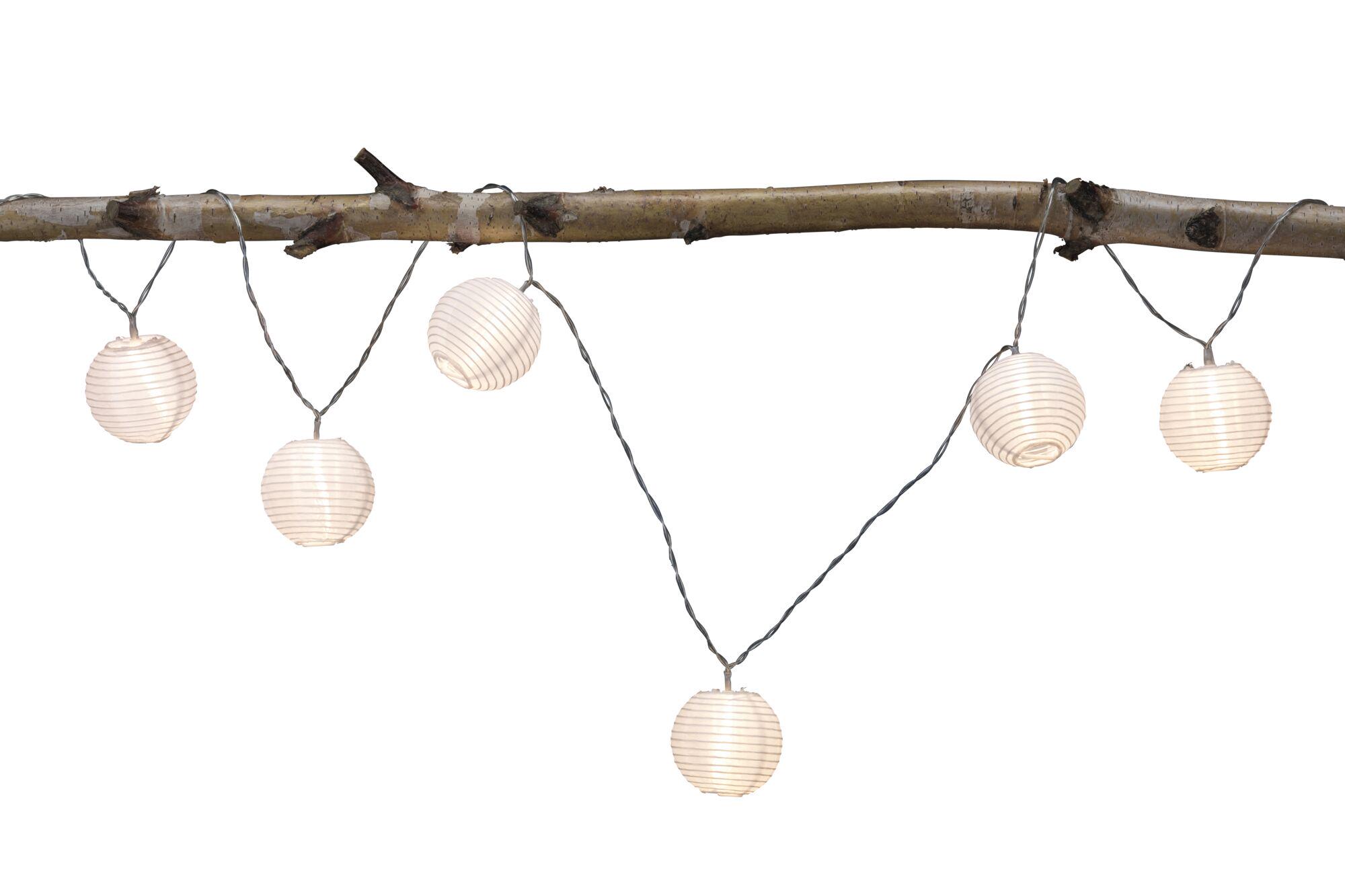String lights with white paper lanterns on brown wooden branch, decorative LED lighting for indoor and outdoor