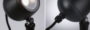 Black metal LED outdoor spotlight with adjustable head and weatherproof cable connection for garden lighting