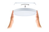 White round LED ceiling light in plastic with mounting bracket and hands showing installation