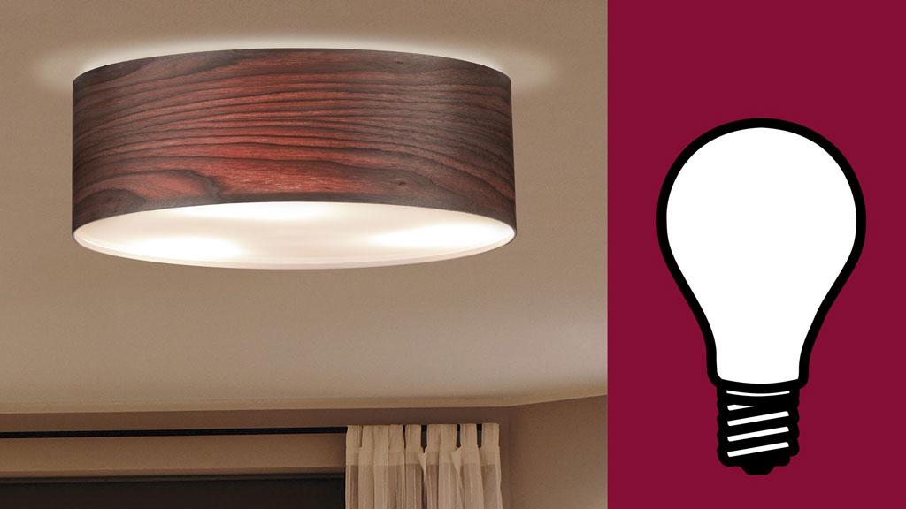 Plafonnier effet bois avec diffuseur, accompagné d'une icône d'ampoule incandescente classique E27.