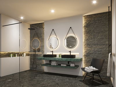 Modernes Badezimmer mit grüner Marmor-Waschtischplatte, schwarzen Waschbecken und runden LED-Spiegeln.