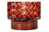 Red glass with zigzag pattern on red base, decorative lighting element for home interiors