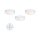 Three white LED ceiling lights with warm white glow and round remote control for dimmable lighting