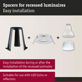 Black plastic spacer and white recessed frame with LED reflectors for easy recessed luminaire installation