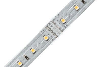 Close-up of silver LED strip with yellow LEDs and 24V markings for lighting applications.