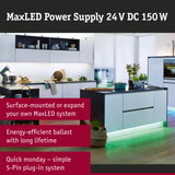 Modern white kitchen with LED under-cabinet lighting and green floor accent lighting