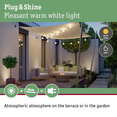 Cozy terrace with warm white LED string lights featuring IP67 waterproof rating for garden lighting