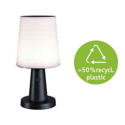 Modern table lamp with black plastic base and white shade made from over 50% recycled plastic