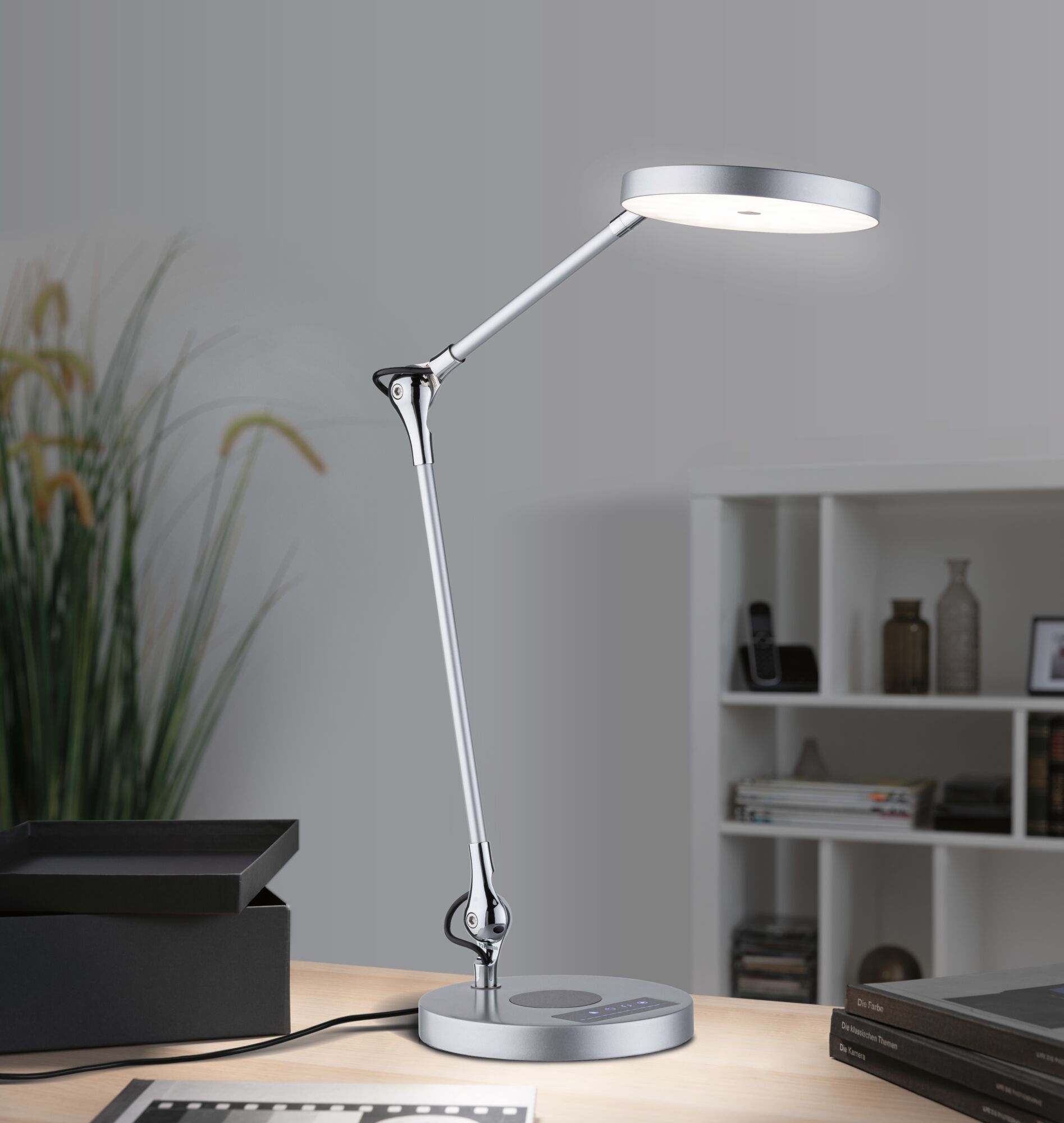 Modern silver metal LED desk lamp with adjustable arm and touch control for office lighting
