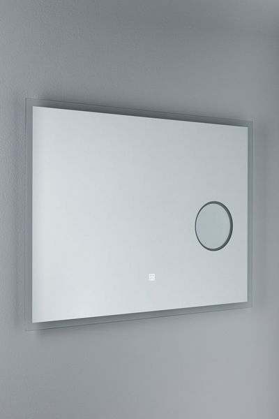 Rectangular wall mirror with LED lighting and magnifying glass in clear glass for bathroom use.