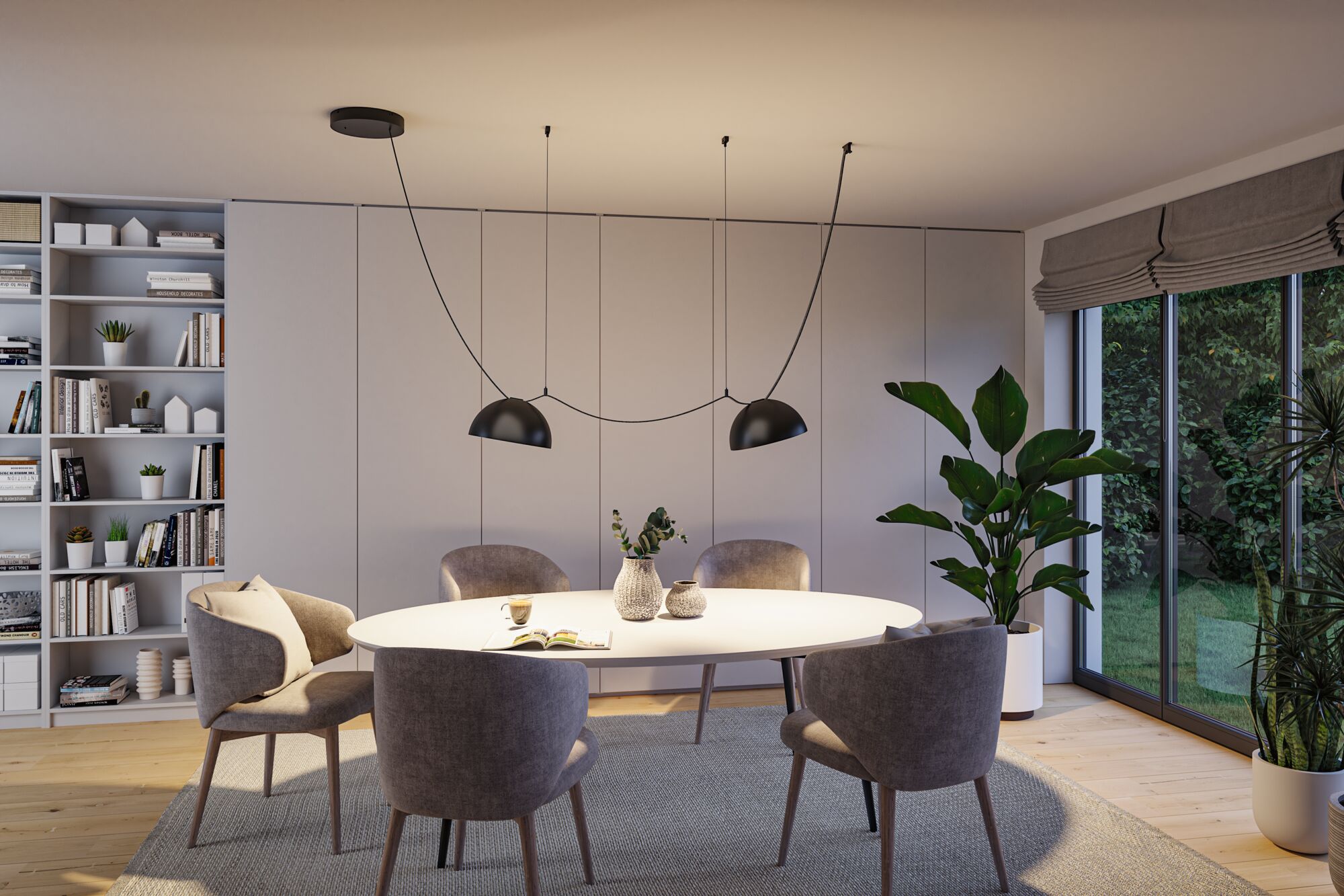 Moderne spisestue med hvidt ovalt bord, grå stole og sort metal pendellampe