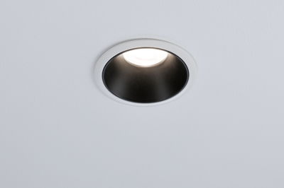 Round recessed light with white frame and black reflector, modern LED ceiling lighting